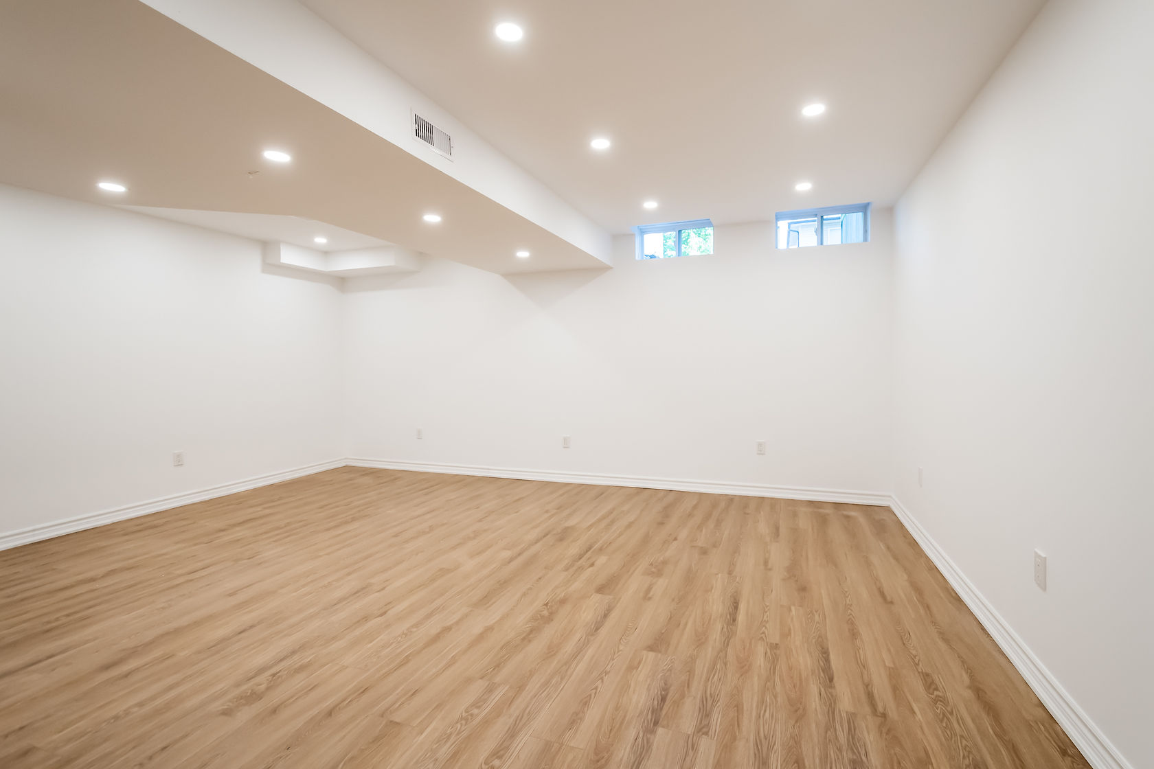 Bright finished basement with excellent recessed lighting and quality flooring — Stonehenge, Hamilton | MTC Renovations